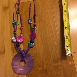 Purple necklace with medallion